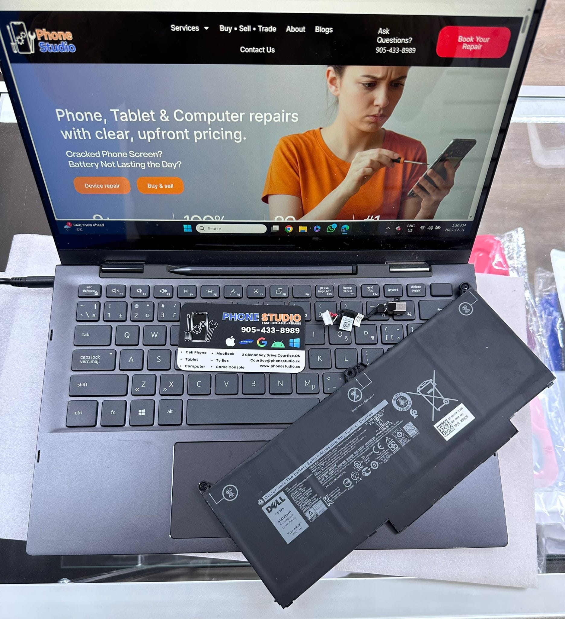 Dell laptop battery replacement on the Phone Studio bench